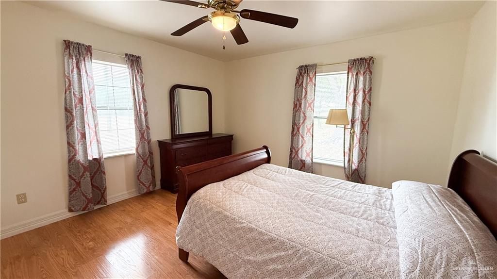 21713 North Western Road Edinburg, TX 78541 - Photo 10 of 24 Bedroom with wood finished floors and ceiling fan