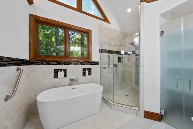 a bathroom with a sink a mirror and a bathtub