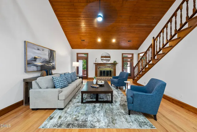 a living room with furniture and a fireplace