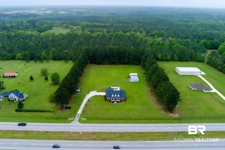 24541 Baldwin Beach Expressway Robertsdale, AL 36567 - Photo 38 of 51 Drone / aerial view featuring a view of trees and a rural view
