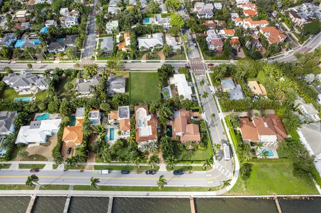 an aerial view of houses with yard