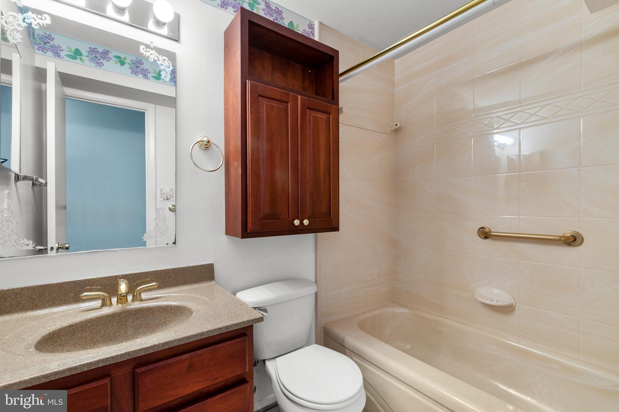 1 Summit Hill Court, Unit T2 Baltimore, MD 21228 - Photo 22 of 24 Updated hall bathroom with shower/tub combination