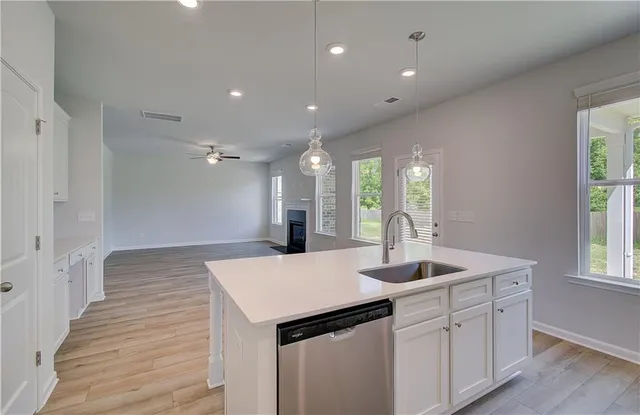 a kitchen with sink and refrigerator