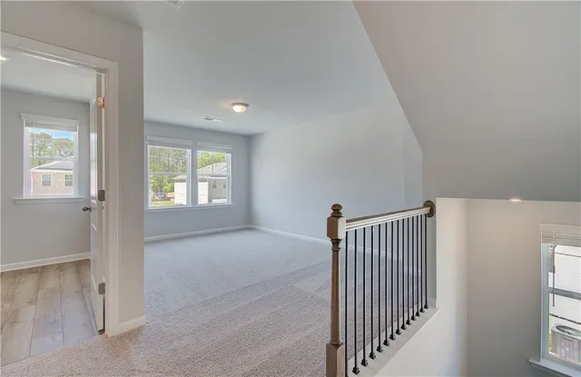 a view of a hallway with windows