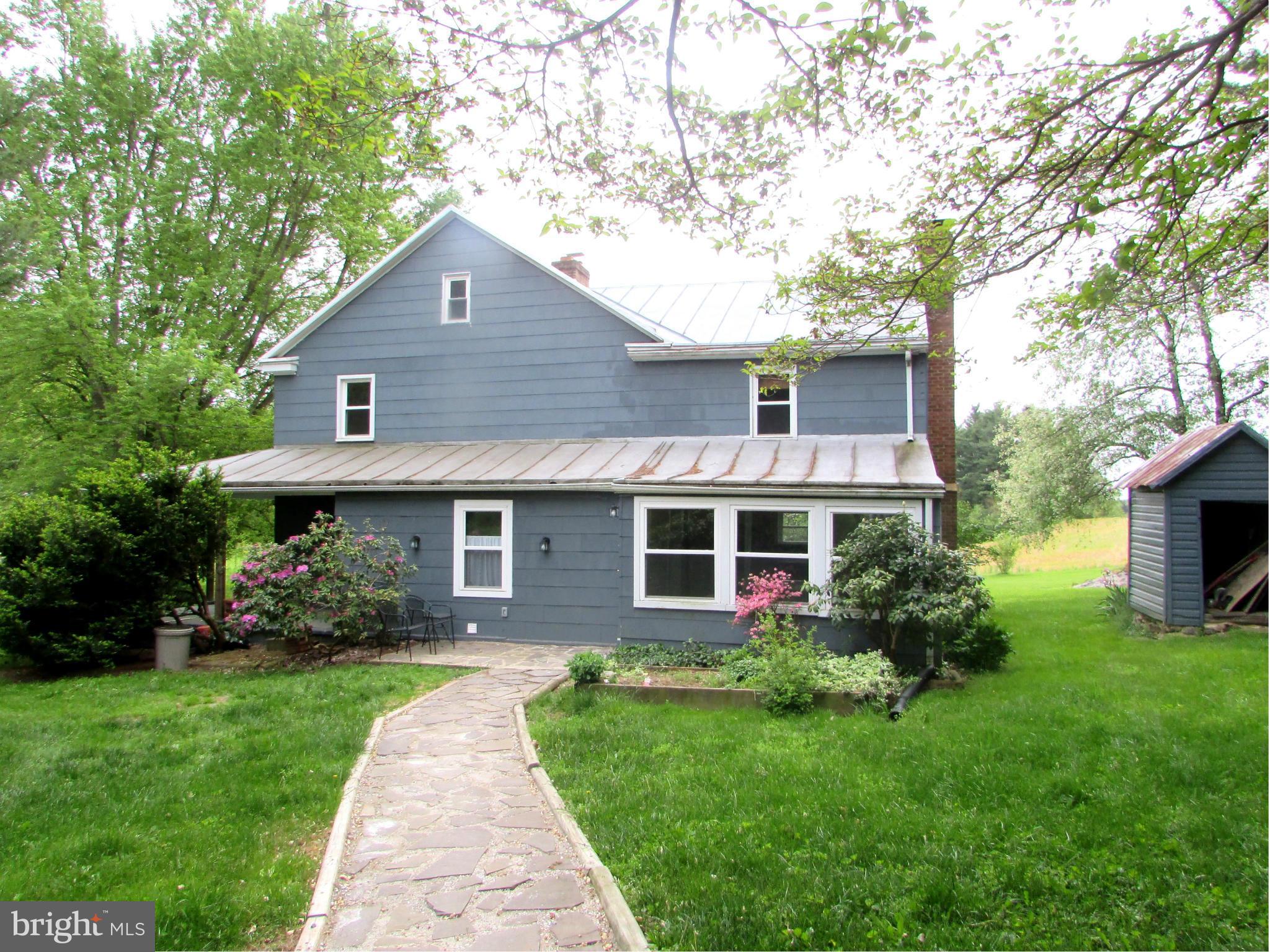 2506 Albert Rill Road Westminster, MD 21157 - Photo 1 of 29 Stone walkway to side of house at kitchen