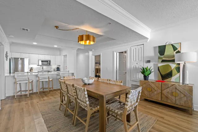 a view of a dining room with furniture and wooden floor