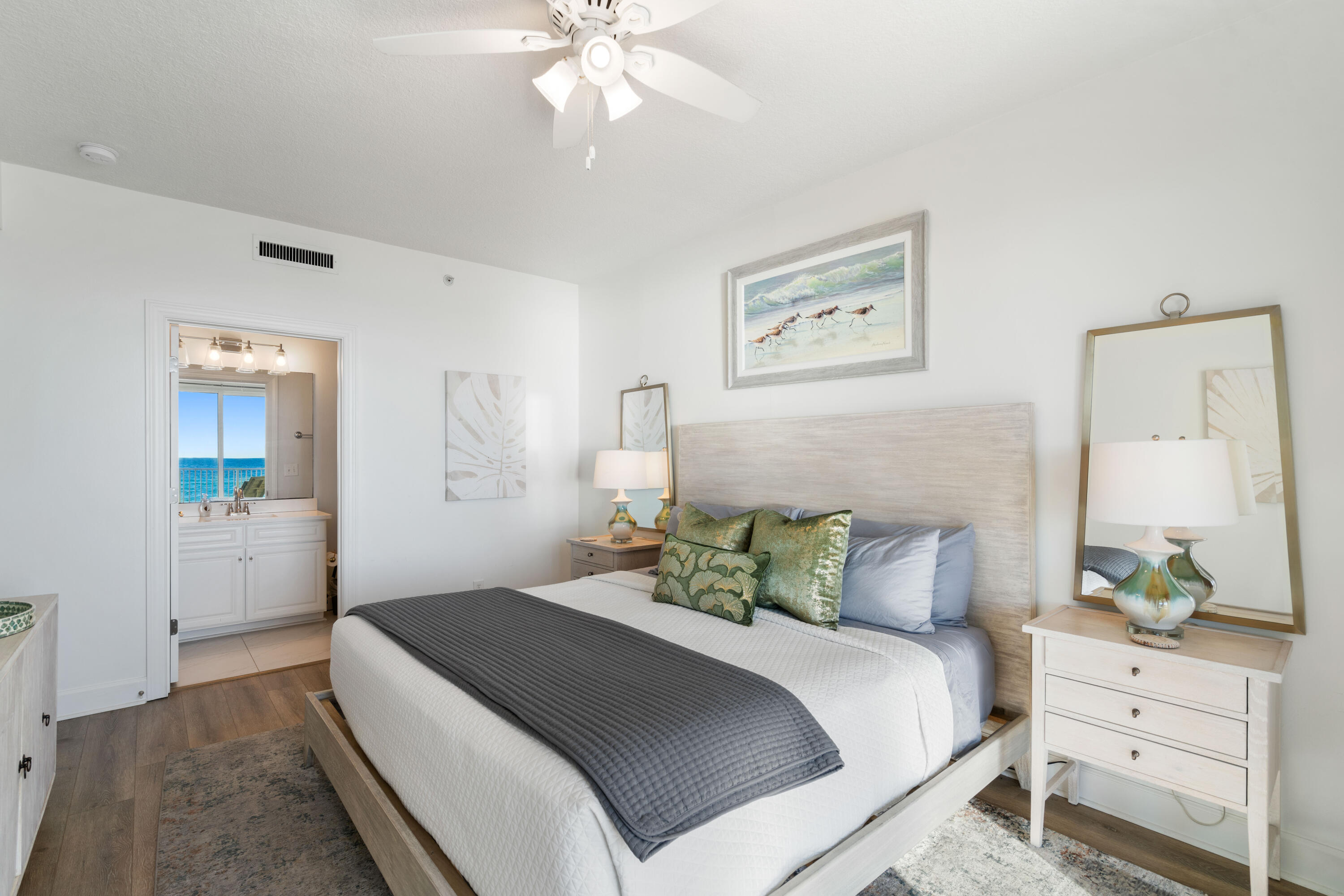 10611 Front Beach Road, Unit 303 Panama City Beach, FL 32408 - Photo 27 of 51 a bedroom with a bed and a chandelier