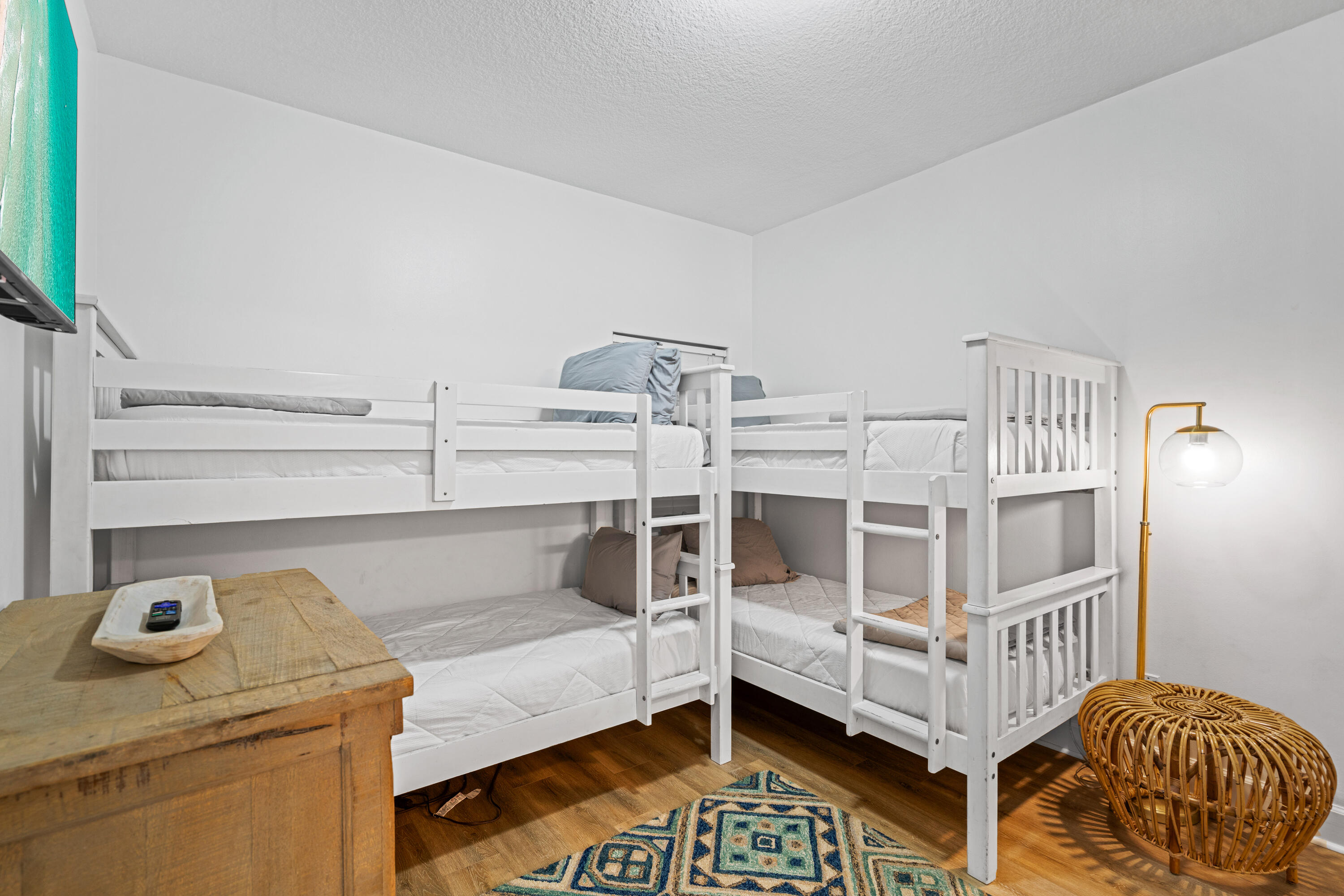 10611 Front Beach Road, Unit 303 Panama City Beach, FL 32408 - Photo 41 of 51 a bedroom with furniture and a window