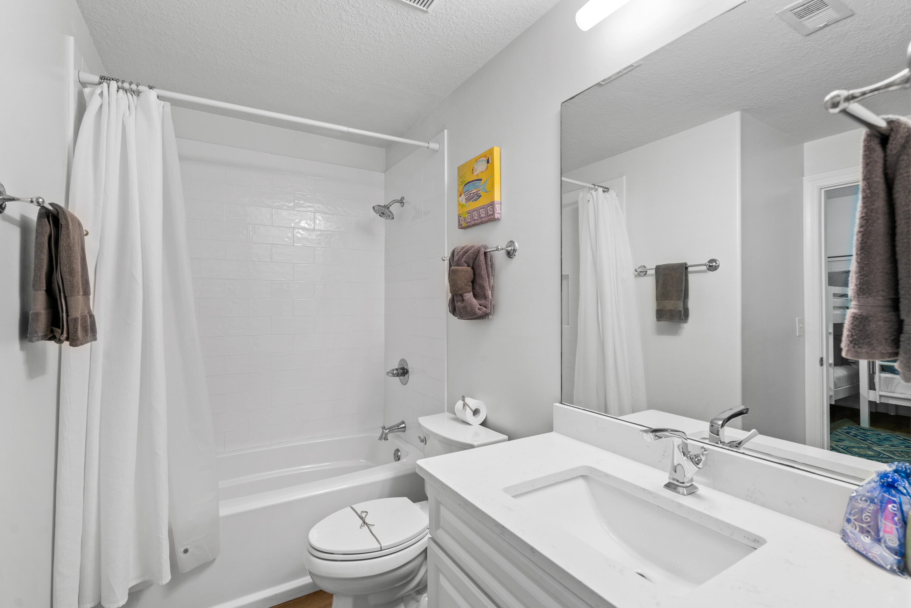 10611 Front Beach Road, Unit 303 Panama City Beach, FL 32408 - Photo 44 of 51 a bathroom with a sink toilet and shower