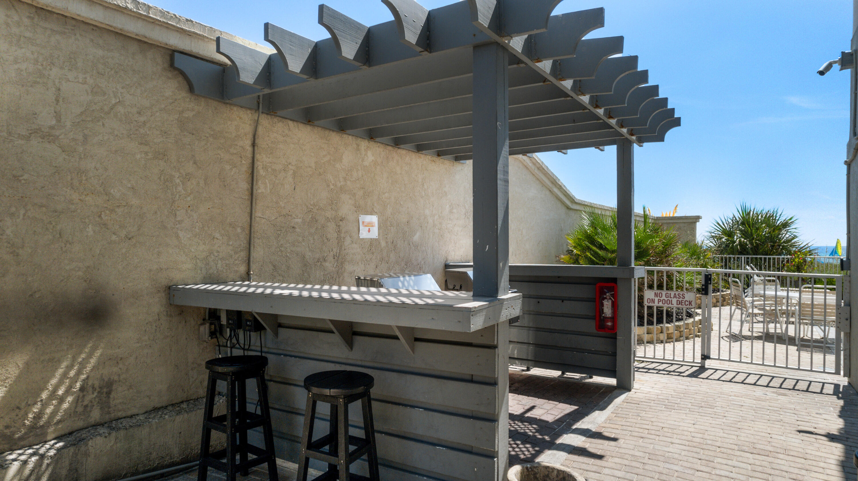 10611 Front Beach Road, Unit 303 Panama City Beach, FL 32408 - Photo 51 of 51 a view of a terrace with furniture and wooden floor