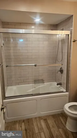 a bathroom with a shower and bathtub