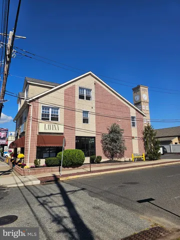 a front view of a building with street view