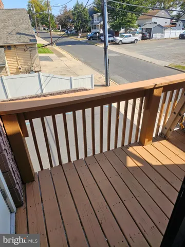 a view of balcony with wooden floor
