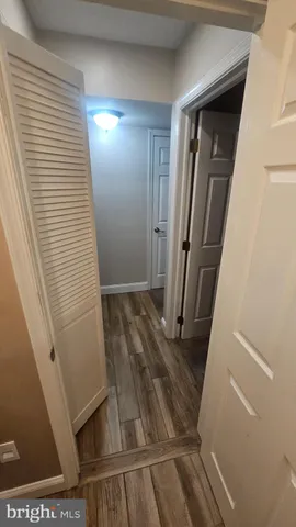 a view of a hallway with washer and dryer