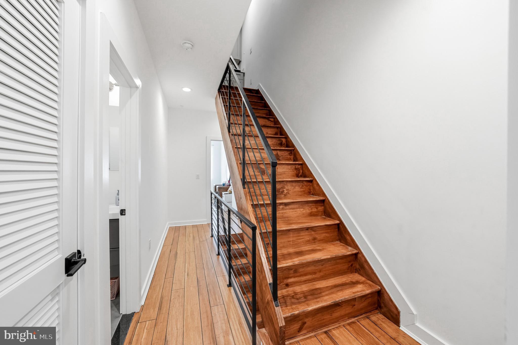 2604 Reed Street Philadelphia, PA 19146 - Photo 21 of 45 a view of a hallway with wooden floor and staircase