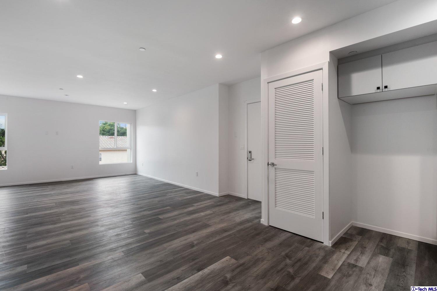 7064 Greeley Street, Unit 202 Tujunga, CA 91042 - Photo 23 of 45 an empty room with wooden floor & closet area