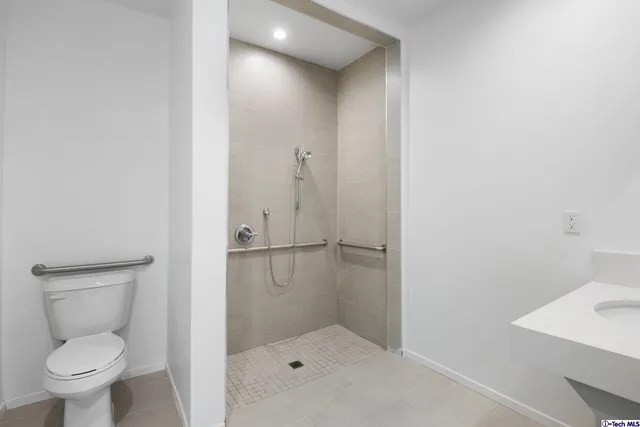 a view of room with window and wooden floor