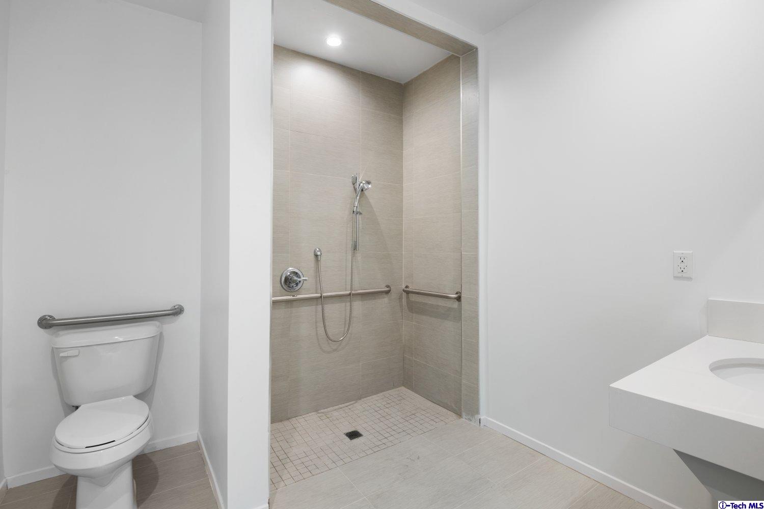 7064 Greeley Street, Unit 202 Tujunga, CA 91042 - Photo 26 of 45 a bathroom with a toilet and a sink