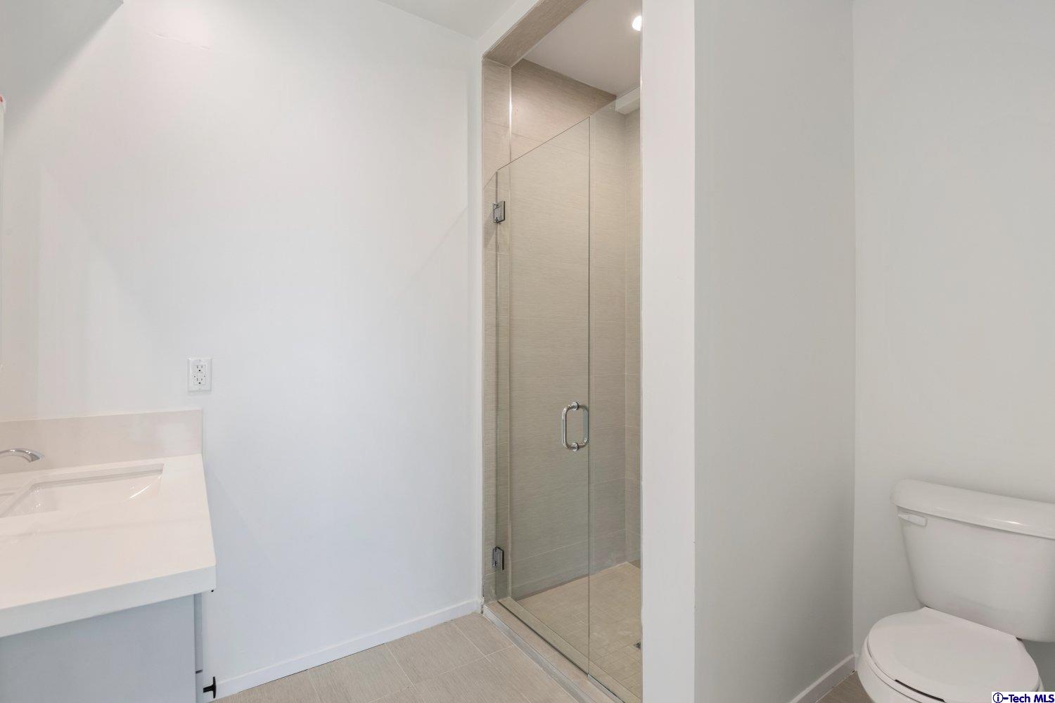 7064 Greeley Street, Unit 202 Tujunga, CA 91042 - Photo 34 of 45 a bathroom with a sink and toilet