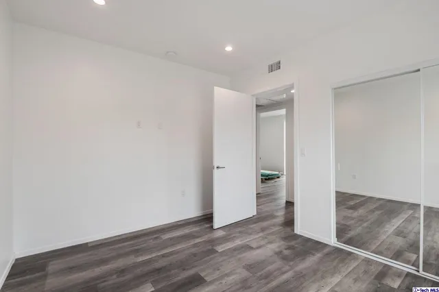 a view of a backyard with potted plants