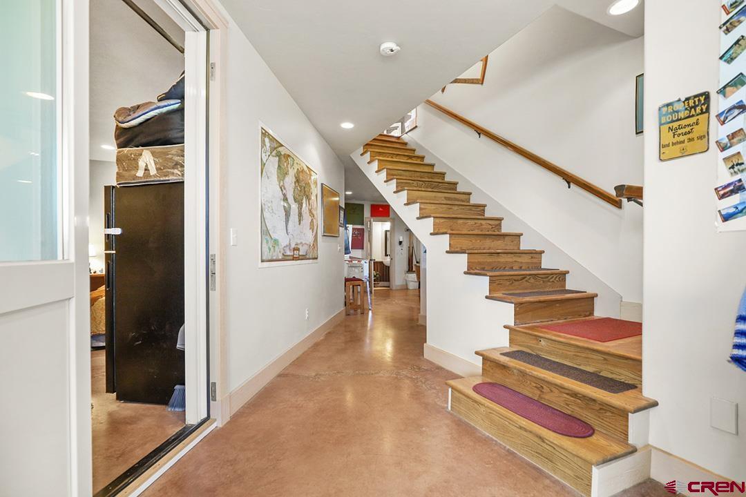 22259 Rd U Cortez, CO 81321 - Photo 19 of 35 a view of entryway and hall with wooden floor
