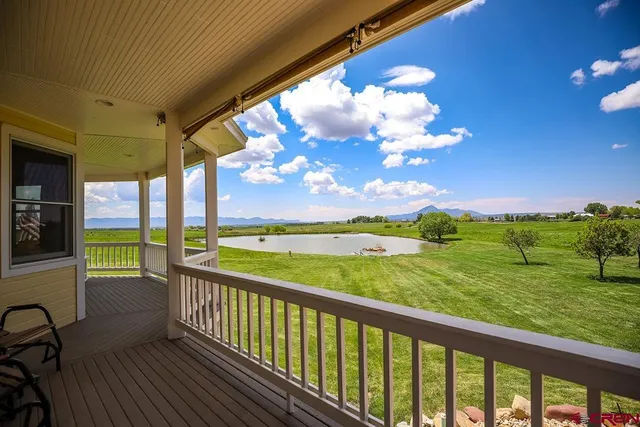 a view of a balcony with lake view