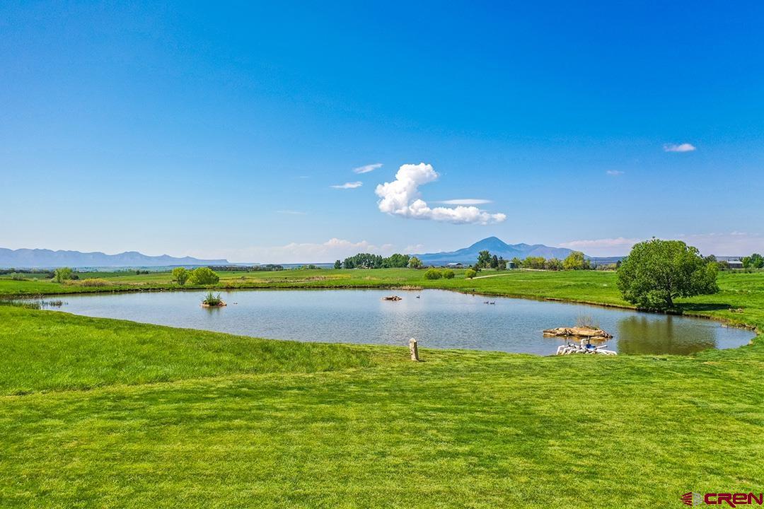 22259 Rd U Cortez, CO 81321 - Photo 31 of 35 a view of a lake with houses in the back