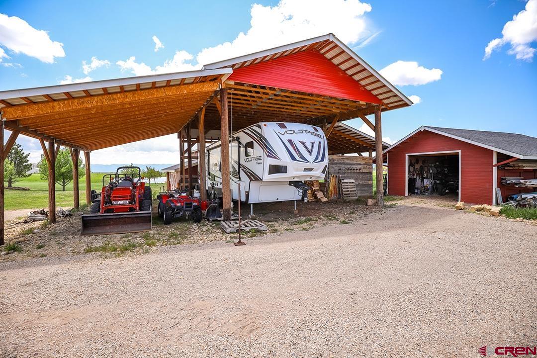 22259 Rd U Cortez, CO 81321 - Photo 32 of 35 a view of a house with a backyard