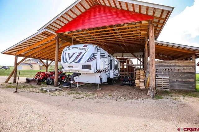 a view of a two chairs under an umbrella