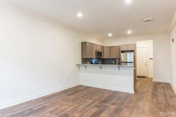 a view of kitchen with wooden floor