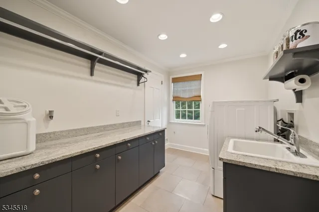 a bathroom with a granite countertop sink a toilet and shower