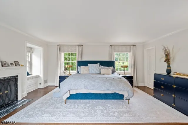 a spacious bedroom with a large bed and a dresser