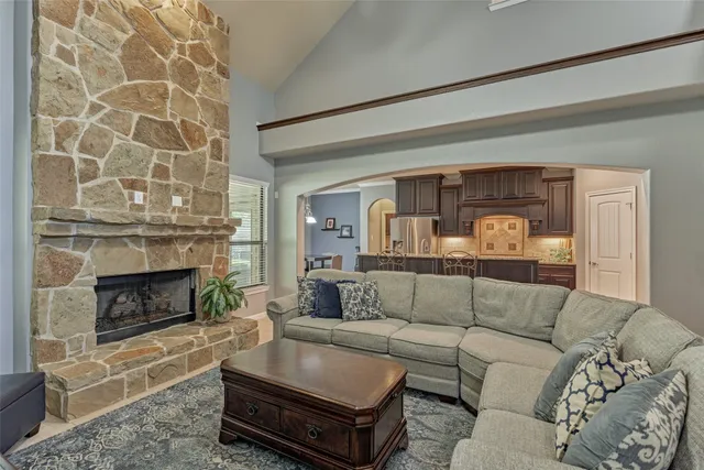 a living room with a couch and a fireplace