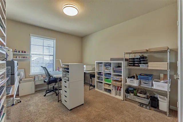 a view of a workspace with furniture