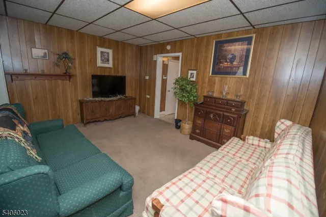 a bedroom with furniture and a flat screen tv