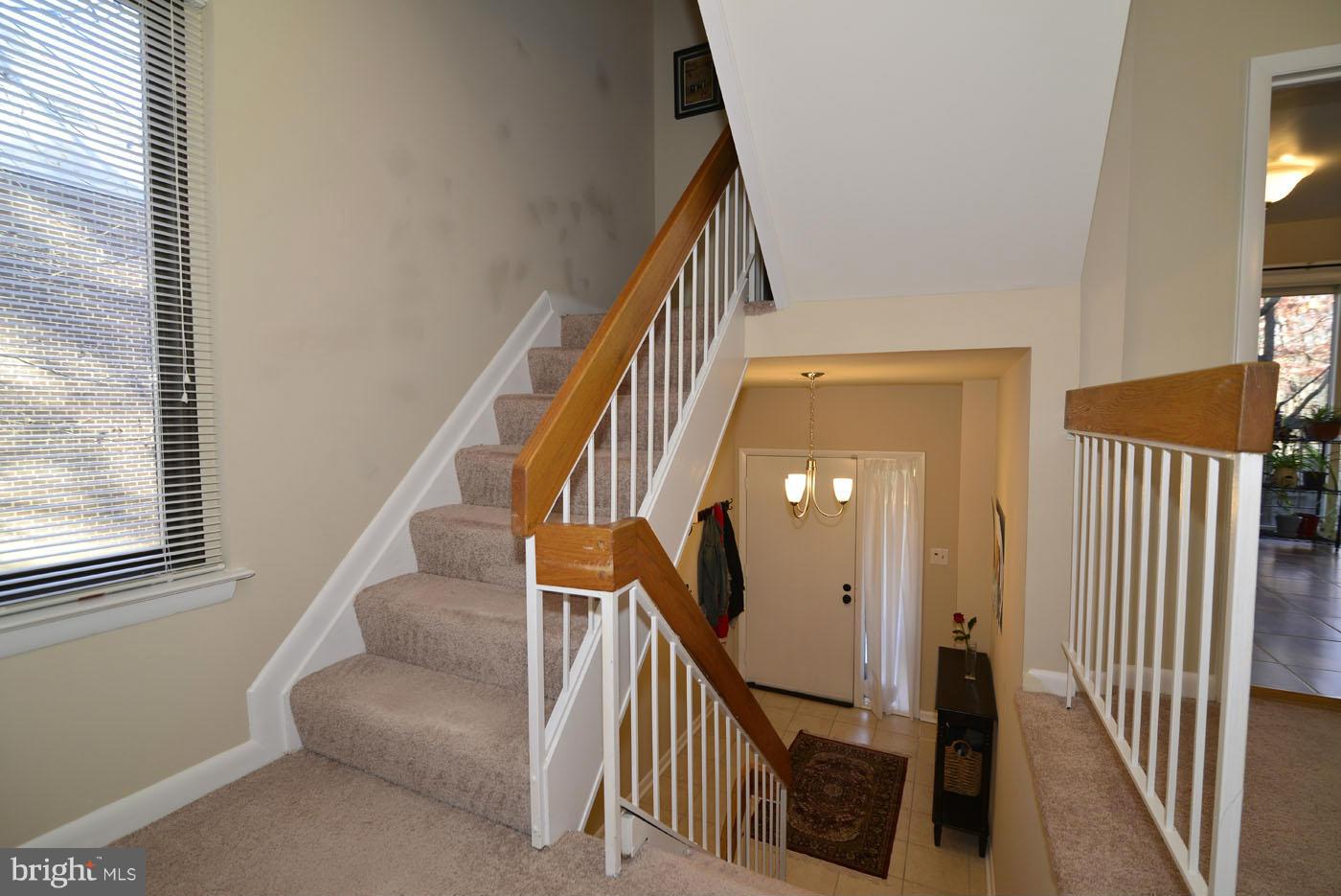 12019 Insha Court Reston, VA 20191 - Photo 14 of 27 a view of entryway and hall with wooden floor