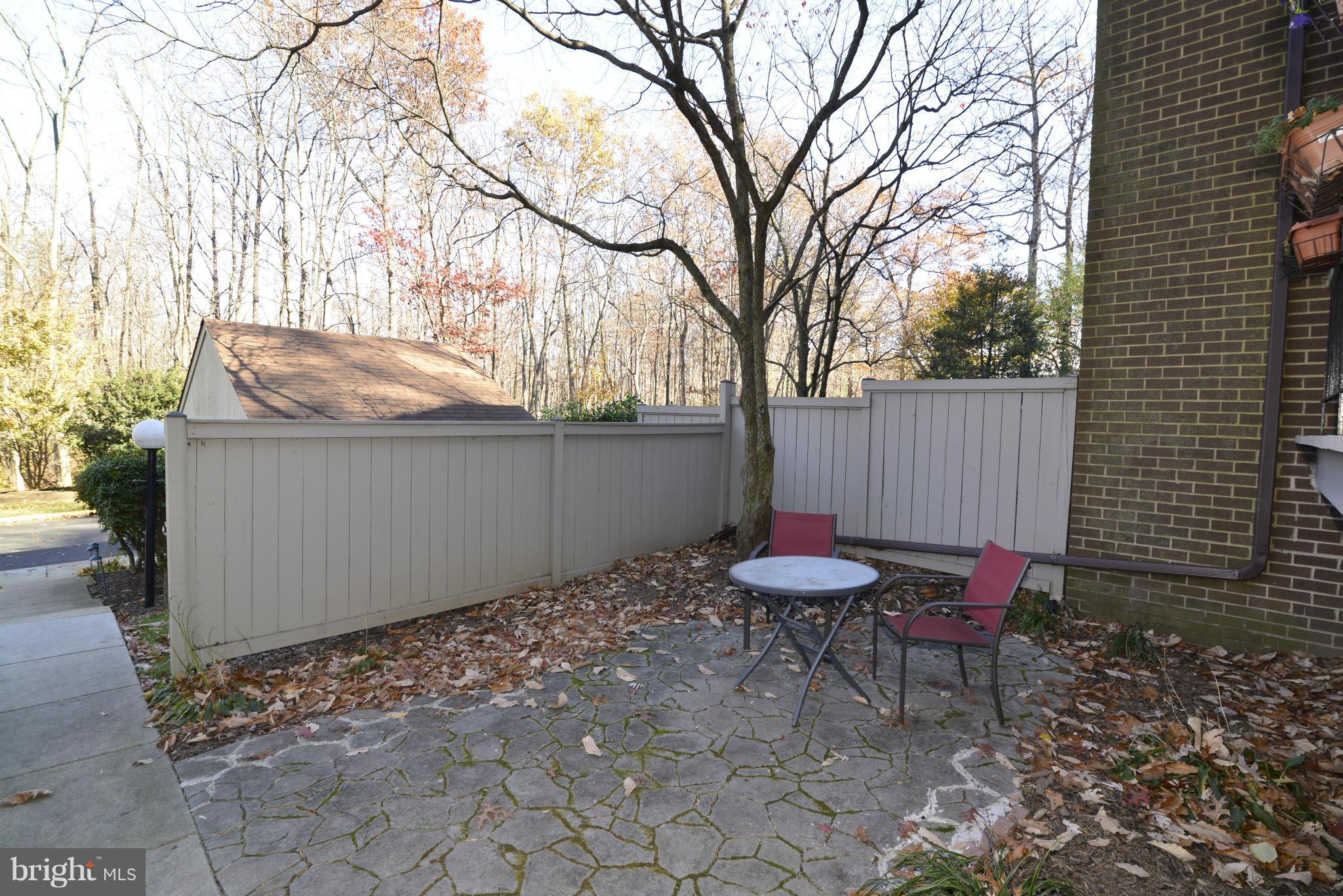 12019 Insha Court Reston, VA 20191 - Photo 3 of 27 a backyard of a house with chairs and table and chairs