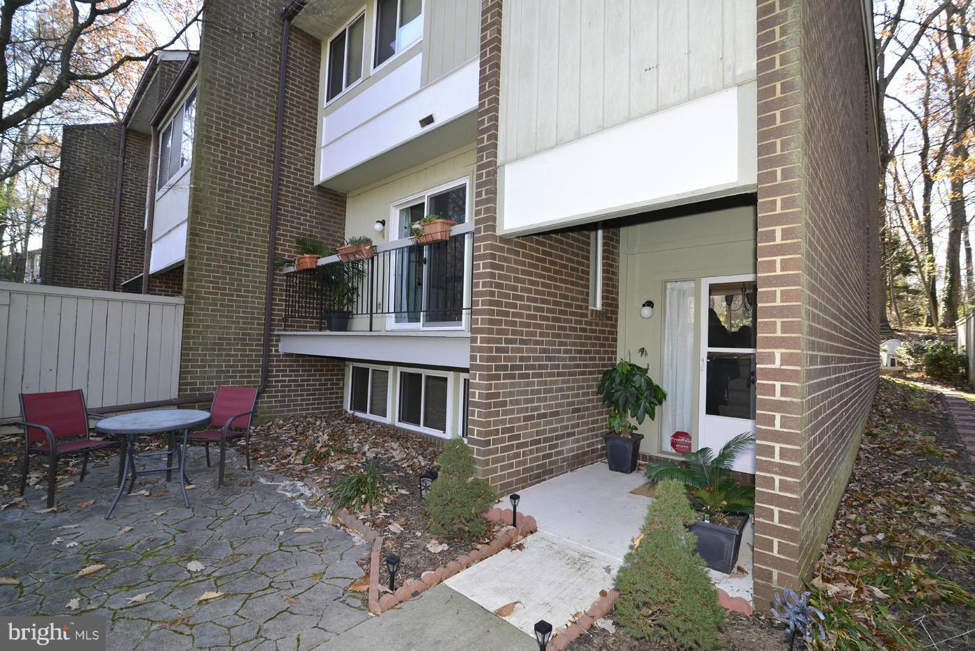 12019 Insha Court Reston, VA 20191 - Photo 4 of 27 a front view of a house with outdoor seating