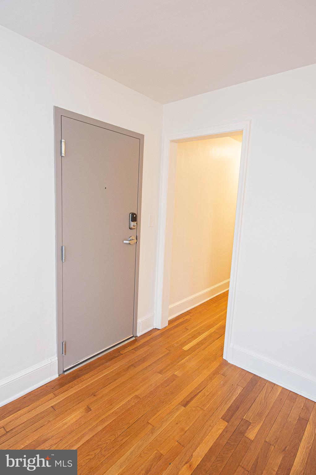 308 North Division Street, Unit 7 Salisbury, MD 21801 - Photo 16 of 56 a view of an empty room with wooden floor