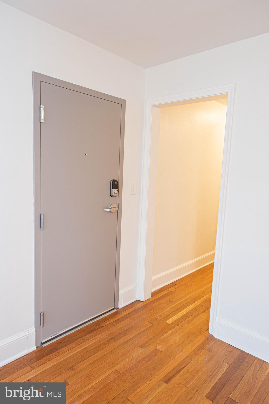 308 North Division Street, Unit 7 Salisbury, MD 21801 - Photo 17 of 56 a view of an empty room with wooden floor