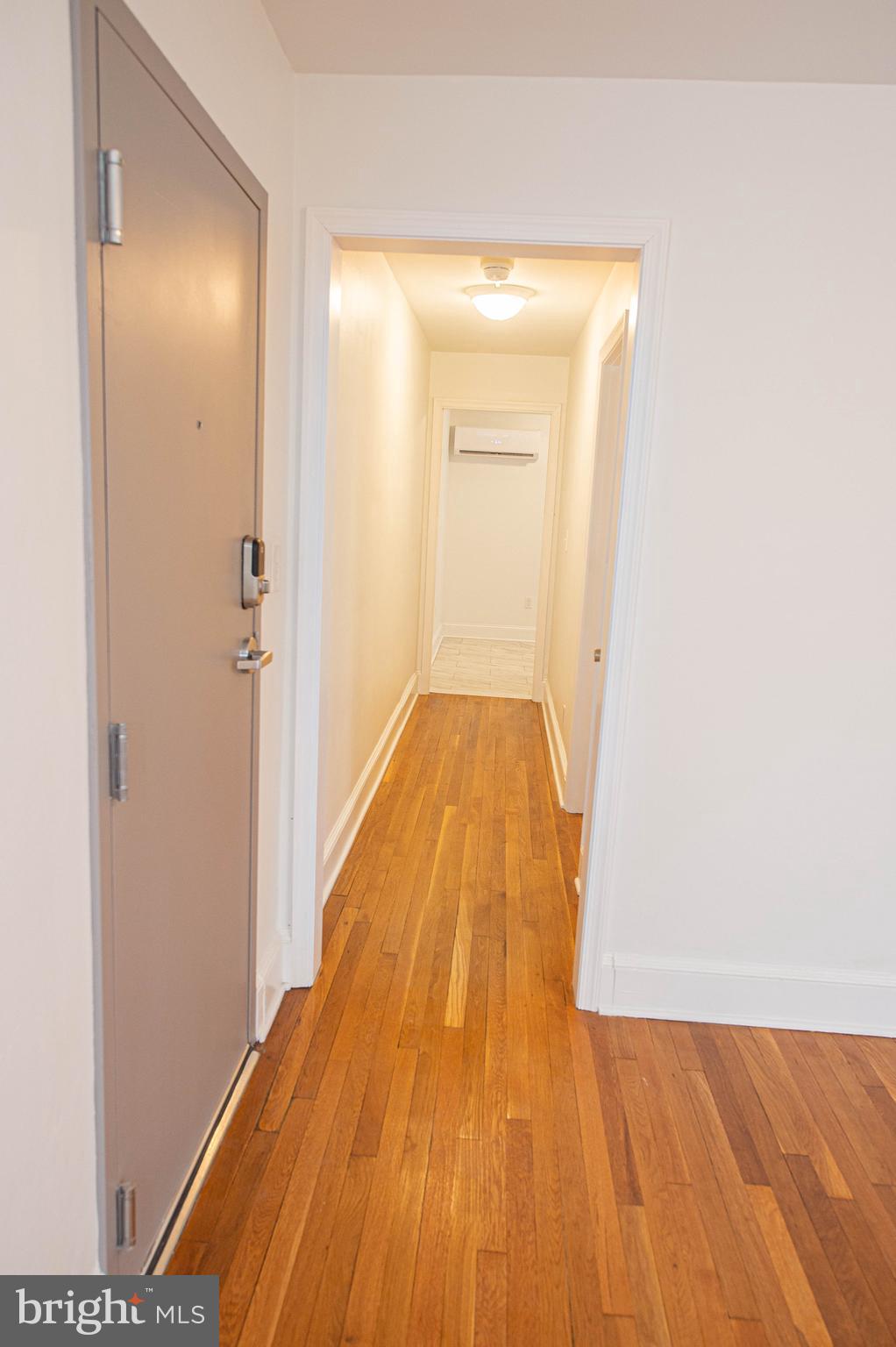 308 North Division Street, Unit 7 Salisbury, MD 21801 - Photo 18 of 56 a view of a room with wooden floor