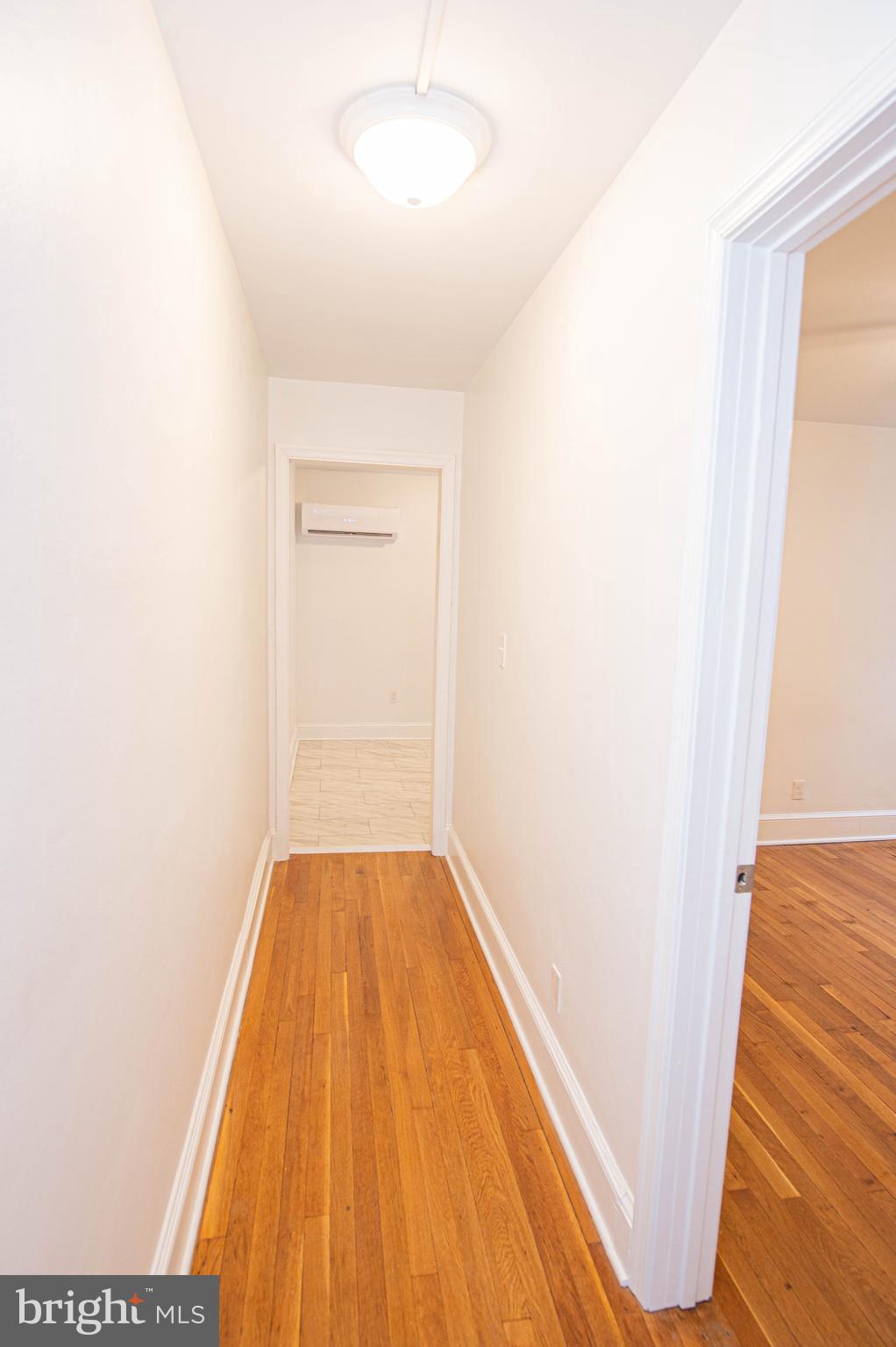 308 North Division Street, Unit 7 Salisbury, MD 21801 - Photo 27 of 56 a view of hallway with wooden floor