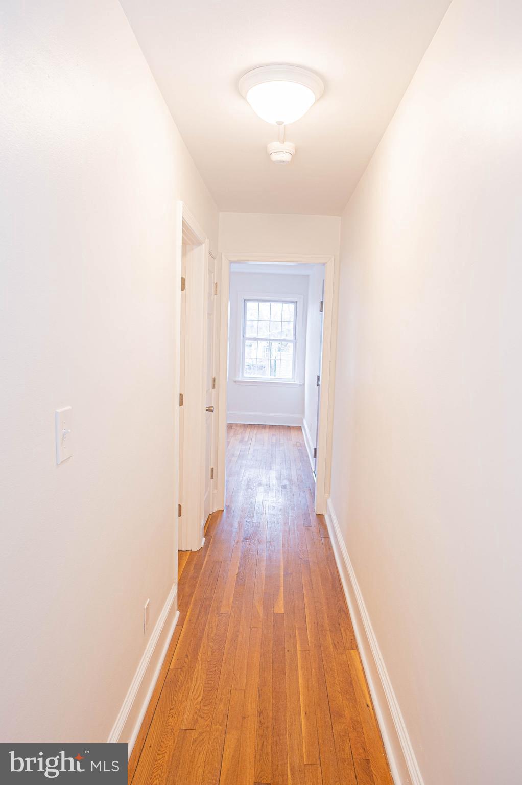 308 North Division Street, Unit 7 Salisbury, MD 21801 - Photo 40 of 56 a view of a room with wooden floor