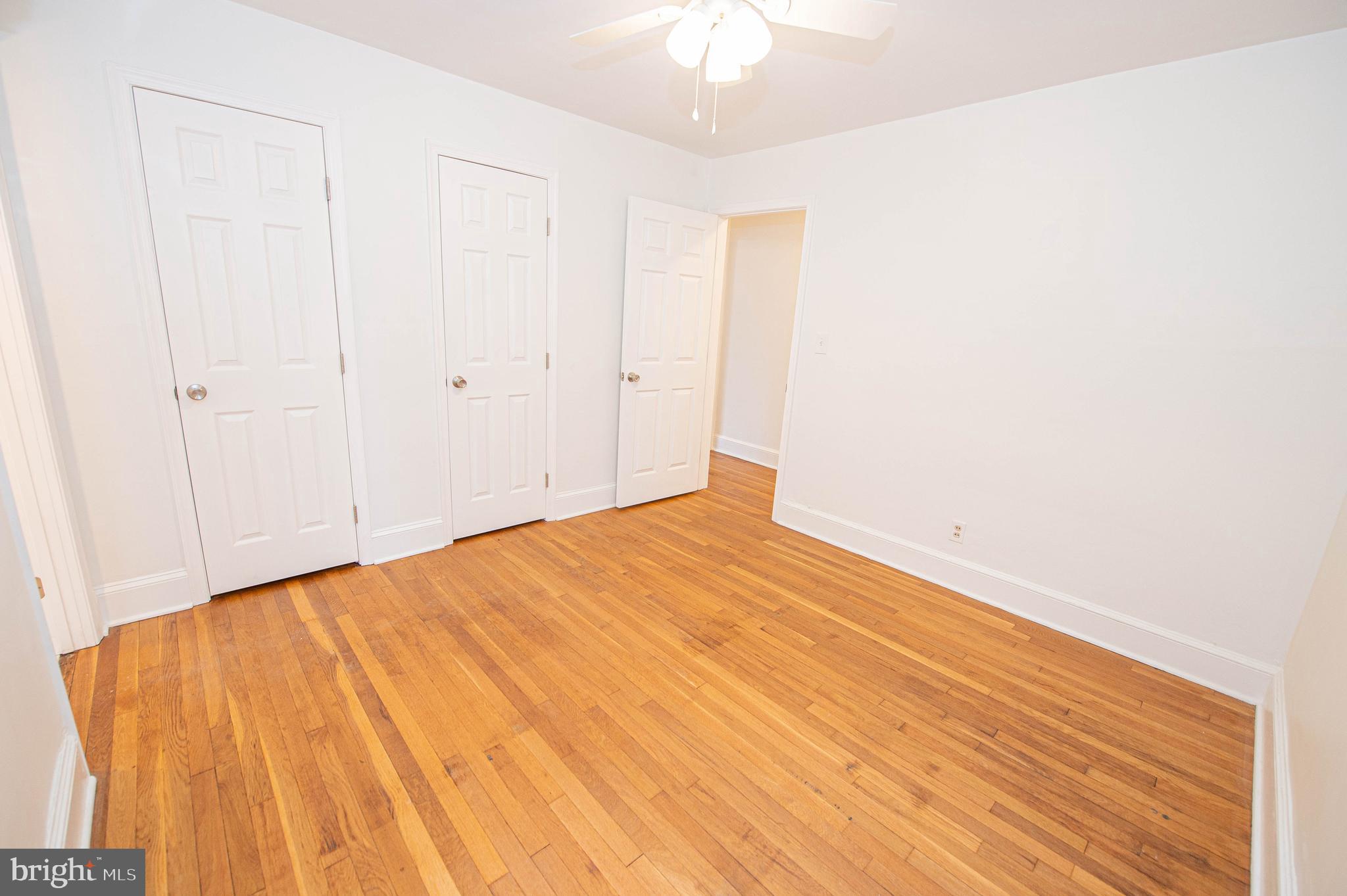 308 North Division Street, Unit 7 Salisbury, MD 21801 - Photo 43 of 56 a view of empty room with wooden floor