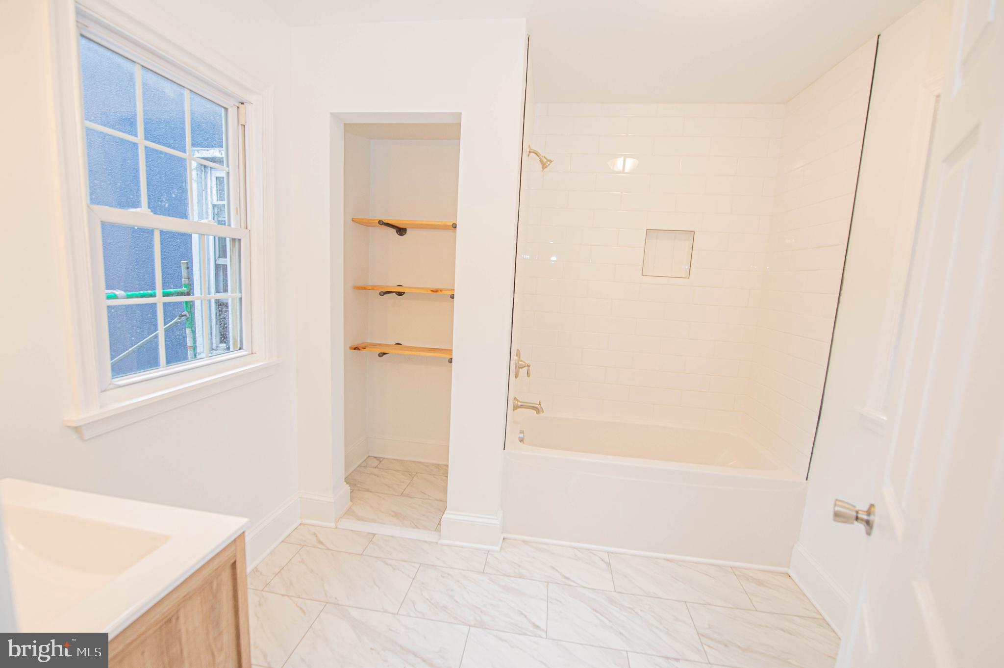 308 North Division Street, Unit 7 Salisbury, MD 21801 - Photo 46 of 56 a bathroom with a bathtub and shower