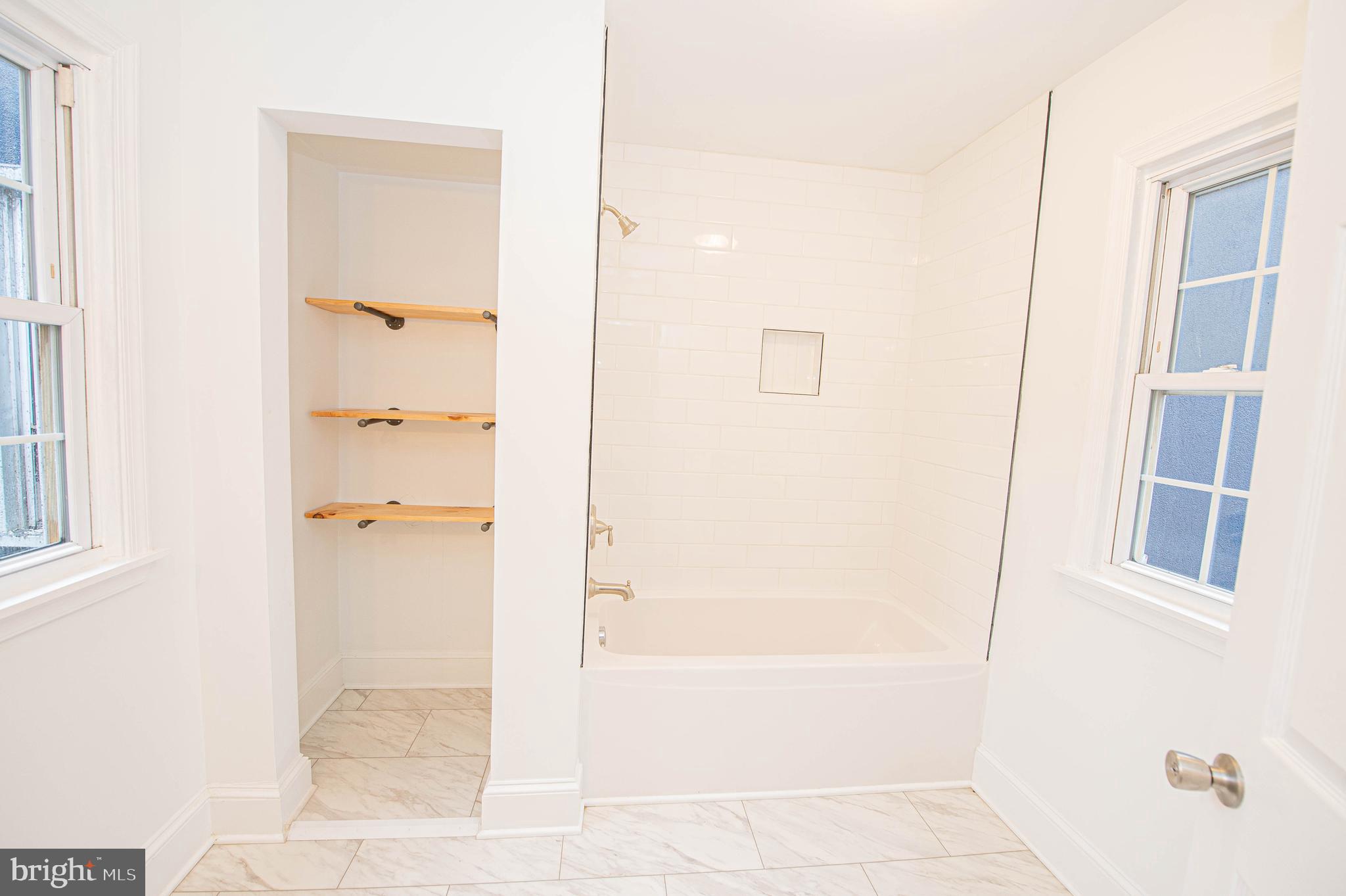 308 North Division Street, Unit 7 Salisbury, MD 21801 - Photo 47 of 56 a bathroom with a bathtub