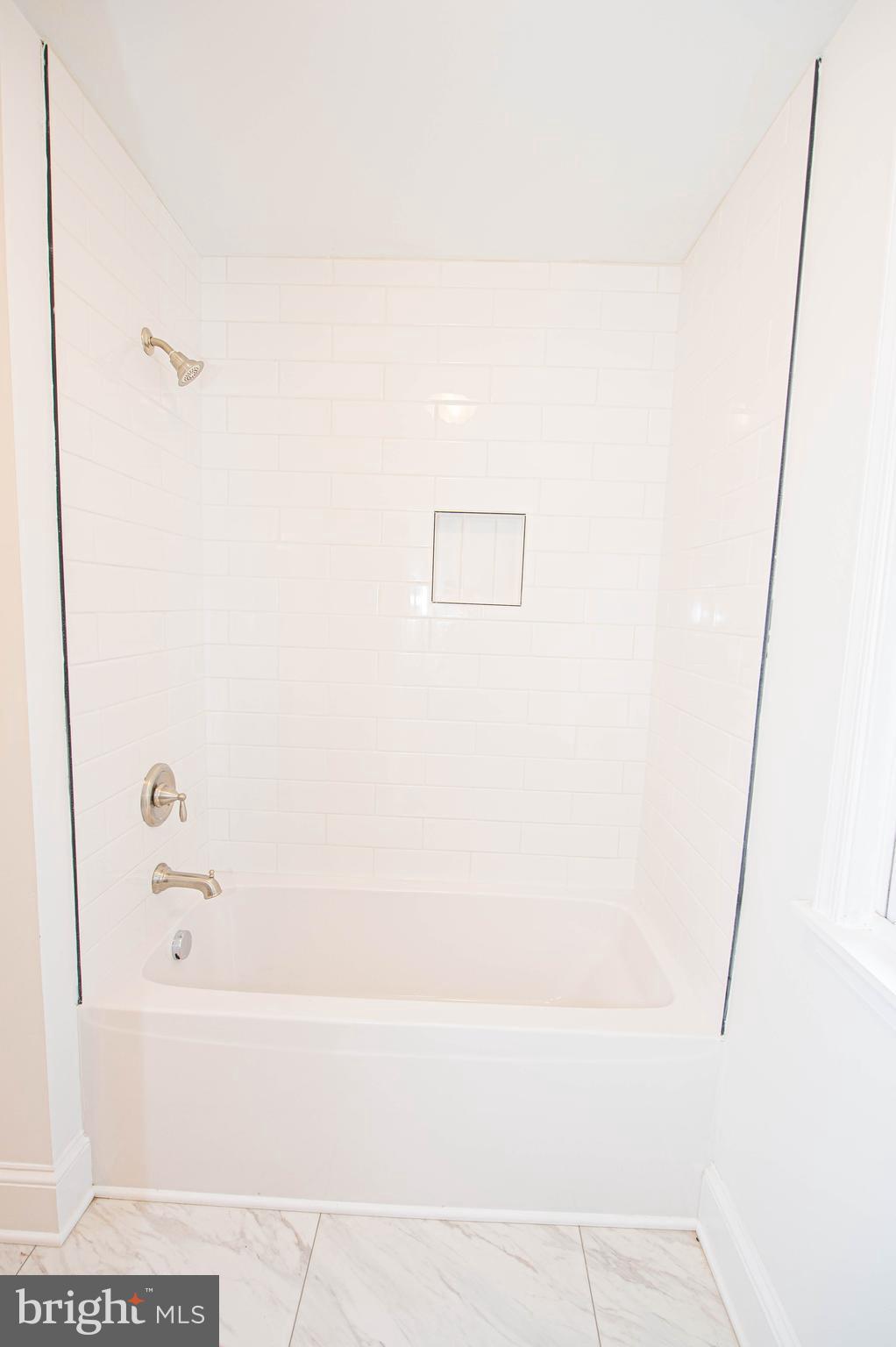 308 North Division Street, Unit 7 Salisbury, MD 21801 - Photo 50 of 56 a bathroom with a bathtub