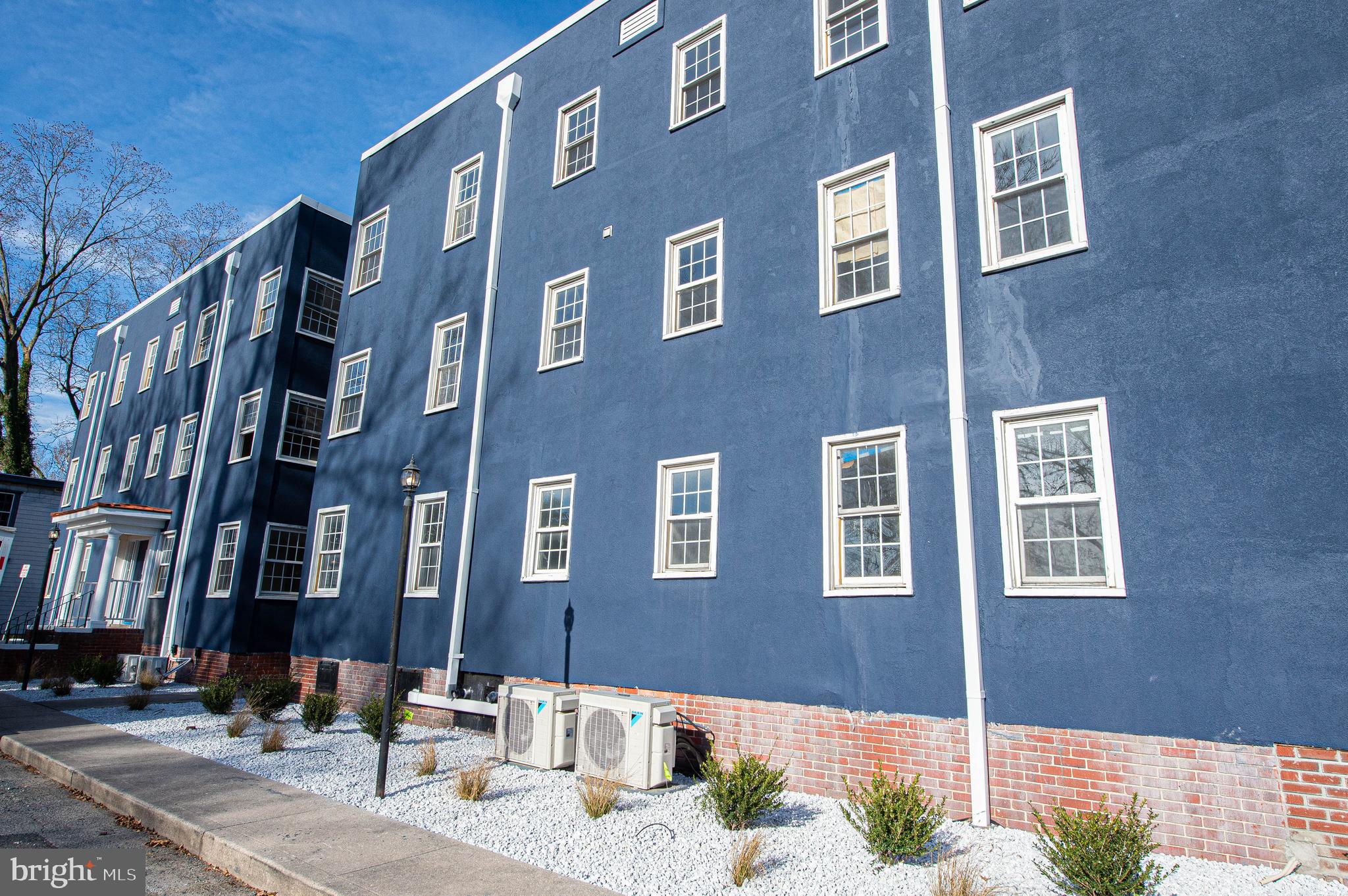 308 North Division Street, Unit 7 Salisbury, MD 21801 - Photo 5 of 56 a brick building with multiple windows