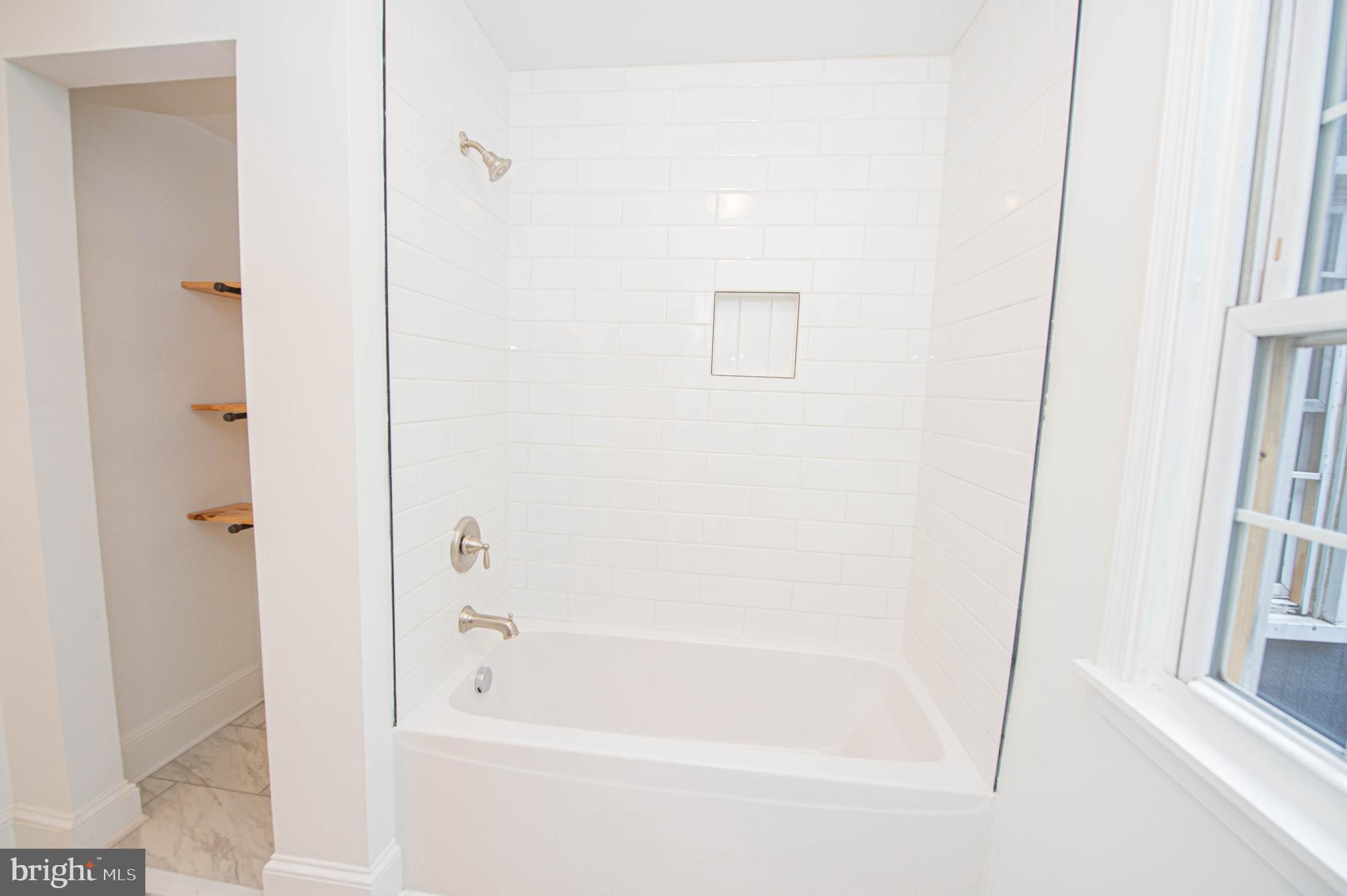 308 North Division Street, Unit 7 Salisbury, MD 21801 - Photo 51 of 56 a bathroom with a bathtub
