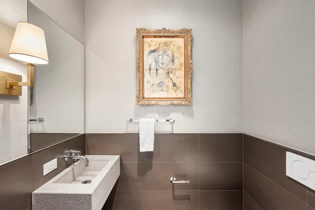 a living room with furniture wooden floor and a large window